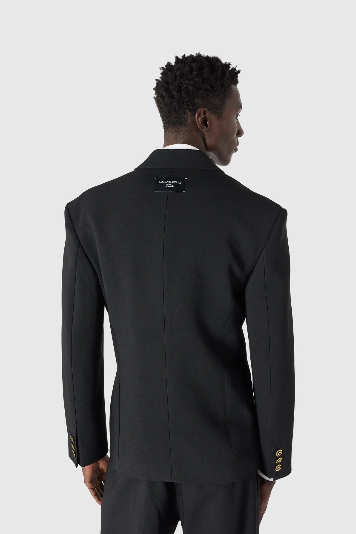 Veste tailleur en serge de laine à boutons dorés